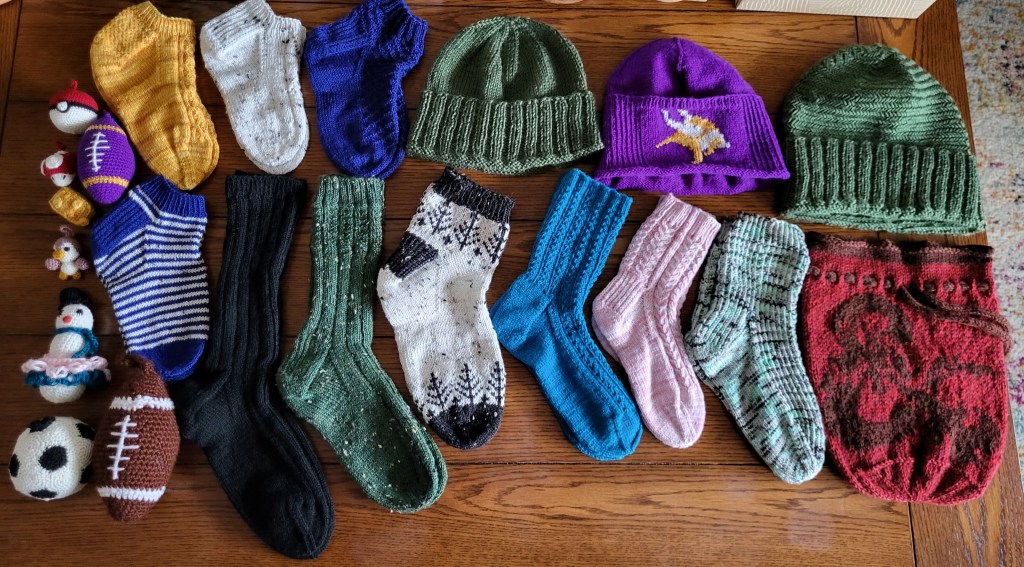 An array of handknitted and crocheted Christmas gifts.