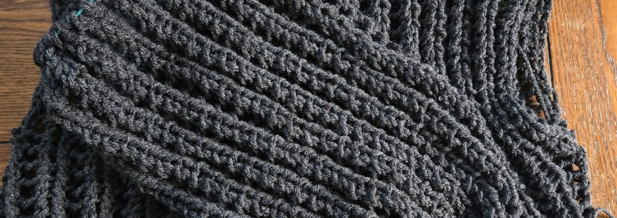 A black sweater and partially finished sleeve.